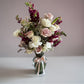 Skye Rose Floral Sophisticated Mauve bouquet with cream and dusty mauve roses and burgundy snapdragons in a glass vase